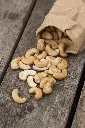 overturned-paper-bag-filled-with-healthy-raw-cashew-nuts.webp
